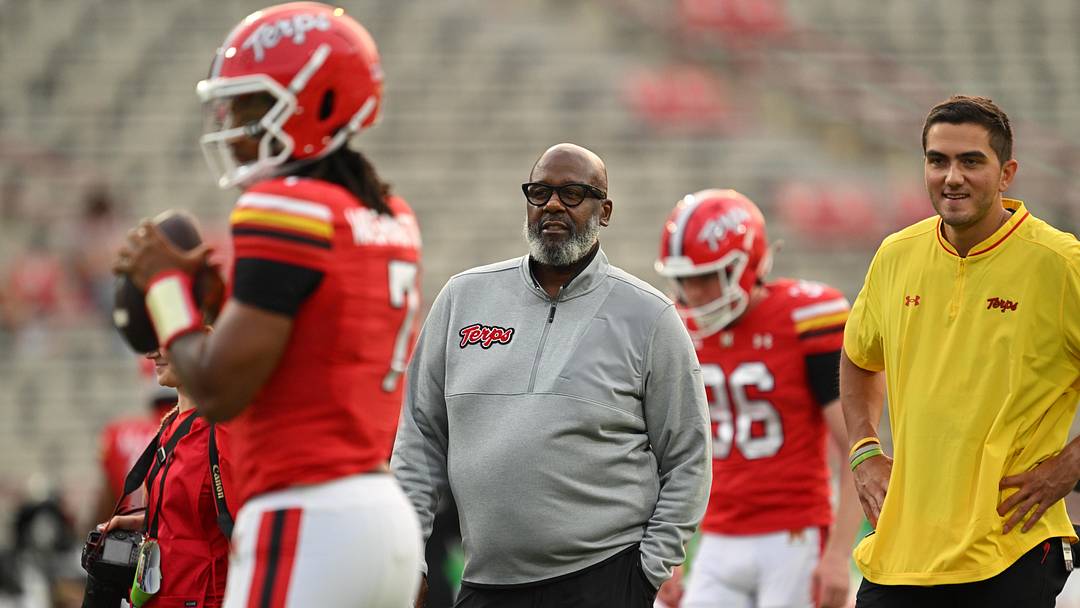 Sep 5, 2025; College Park, Maryland, USA;  Maryland Terrapins head coach Michael Locksley watches his team warm up before a game against the Northern Illinois Huskies at SECU Stadium. Mandatory Credit: Jamie Sabau-Imagn Images