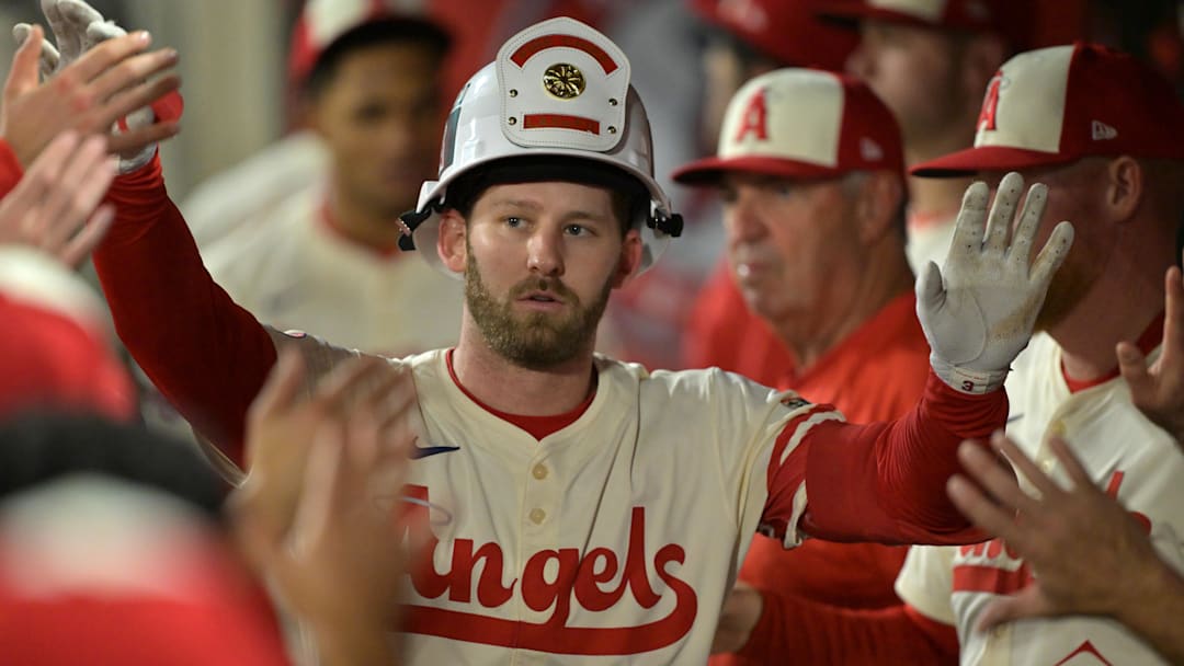 Sep 24, 2025; Anaheim, California, USA;  Los Angeles Angels left fielder Taylor Ward (3) is congratulated in the dugout after hitting a solo home run in the third inning against the Kansas City Royals at Angel Stadium. Mandatory Credit: Jayne Kamin-Oncea-Imagn Images