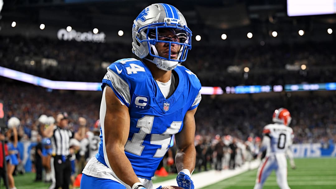 Sep 28, 2025; Detroit, Michigan, USA; Detroit Lions wide receiver Amon-Ra St. Brown (14) celebrates after catching a touchdown pass during the first half against the Cleveland Browns at Ford Field. Mandatory Credit: Lon Horwedel-Imagn Images