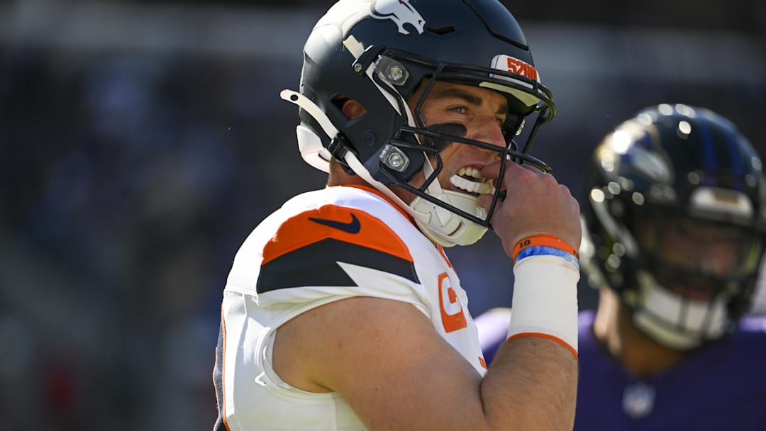 Nov 3, 2024; Baltimore, Maryland, USA;  Denver Broncos quarterback Bo Nix (10) reacts after throwing an interception during the first quarter against the Baltimore Ravens at M&T Bank Stadium. 