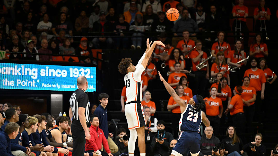 Feb 7, 2026; Corvallis, Oregon, USA; Oregon State Beavers forward Isaiah Sy (13) shoots the ball over Gonzaga Bulldogs guard Adam Miller (23) during the first half at Gill Coliseum. Mandatory Credit: Craig Strobeck-Imagn Images
