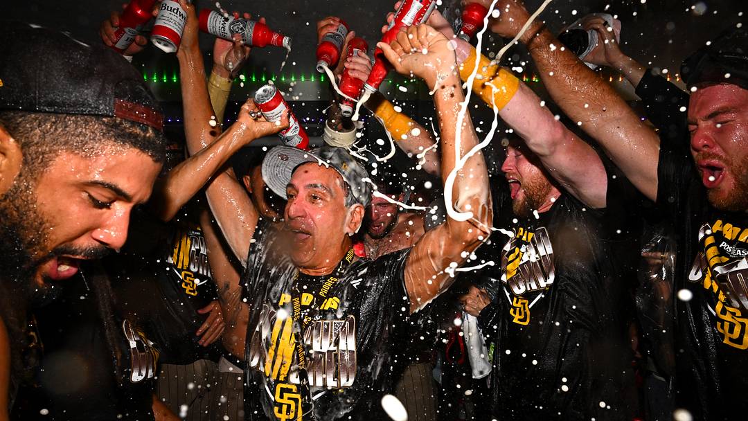 Sep 24, 2026; Los Angeles, California, USA;  San Diego Padres owner Jose E. Feliciano celebrates with the team after securing a playoff spot at Dodger Stadium.  Mandatory Credit: William Liang-Imagn Images