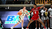 Mar 4, 2025; West Lafayette, Indiana, USA; Purdue Boilermakers guard Fletcher Loyer (2) drives toward the basket in front of Rutgers Scarlet Knights guard Ace Bailey (4) during the first half at Mackey Arena. Mandatory Credit: Marc Lebryk-Imagn Images