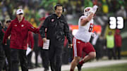 Oct 25, 2025; Eugene, Oregon, USA; Wisconsin Badgers head coach Luke Fickell instructs players during the first half against the Oregon Ducks at Autzen Stadium