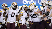 Nov 14, 2025; Eugene, Oregon, USA; Minnesota Golden Gophers wide receiver Javon Tracy (11) celebrates with teammates after scoring a touchdown against the Oregon Ducks at Autzen Stadium. Mandatory Credit: Troy Wayrynen-Imagn Images
