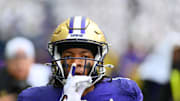 Sep 14, 2024; Seattle, Washington, USA; Washington Huskies cornerback Thaddeus Dixon (9) celebrates after intercepting a pass against the Washington State Cougars during the second half at Lumen Field. Mandatory Credit: Steven Bisig-Imagn Images
