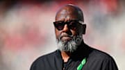 Oct 4, 2025; College Park, Maryland, USA;  Maryland Terrapins head coach Michael Locksley watches his team warm up before a game against the Washington Huskies at SECU Stadium. Credit: Jamie Sabau-Imagn Images