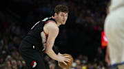 Apr 11, 2025; Portland, Oregon, USA; Portland Trail Blazers center Donovan Clingan (23) looks to pass the ball during the second half against the Golden State Warriors at Moda Center. Mandatory Credit: Troy Wayrynen-Imagn Images