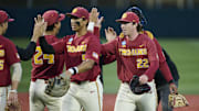 May 31, 2025; Corvallis, OR, USA; USC pitcher Caden Hunter (22) high-fives teammates after a game against Saint Mary's at the NCAA Corvallis Regional at Goss Stadium. Mandatory Credit: Troy Wayrynen-Imagn Images