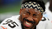 Cleveland Browns defensive end Myles Garrett laughs on the sidelines during the second half against the Detroit Lions.