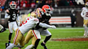 Nov 30, 2025; Cleveland, Ohio, USA;  Cleveland Browns running back Jerome Ford (34) is tackled by San Francisco 49ers safety Malik Mustapha (6) during the second half at Huntington Bank Field. Mandatory Credit: Ken Blaze-Imagn Images
