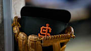 Aug 23, 2022; Detroit, Michigan, USA; The hat and glove of San Francisco Giants third baseman Evan Longoria (10) sits on the edge of the dugout steps during their game against the Detroit Tigers at Comerica Park. Mandatory Credit: Lon Horwedel-Imagn Images