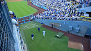 Oct 28, 2025; Los Angeles, California, USA; Los Angeles Dodgers starting pitcher Shohei Ohtani (17) enters the bullpen to warm up for game four of the 2025 MLB World Series against the Toronto Blue Jays at Dodger Stadium. Mandatory Credit: Jayne Kamin-Oncea-Imagn Images