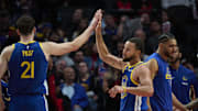Oct 14, 2025; Portland, Oregon, USA; Golden State Warriors guard Stephen Curry (30) high fives center Quinten Post (21) during the second half against th Portland Trail Blazers at Moda Center. Mandatory Credit: Troy Wayrynen-Imagn Images
