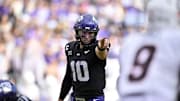 Nov 29, 2025; Fort Worth, Texas, USA; TCU Horned Frogs quarterback Josh Hoover (10) points to Cincinnati Bearcats defensive back Jiquan Sanks (9) during the first quarter at Amon G. Carter Stadium. Mandatory Credit: Jerome Miron-Imagn Images