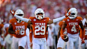Oct 11, 2025; Dallas, Texas, USA; Texas Longhorns defensive back Graceson Littleton (29) celebrates after he intercepts a pass from Oklahoma Sooners quarterback John Mateer (not pictured) during the second half at the Cotton Bowl. Mandatory Credit: Jerome Miron-Imagn Images