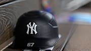 Aug 4, 2025; Arlington, Texas, USA; A view of a New York Yankees helmet and logo before the game between the Texas Rangers and the New York Yankees at Globe Life Field. Mandatory Credit: Jerome Miron-Imagn Images
