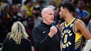 Indiana Pacers Head Coach Rick Carlisle shares a moment with Indiana Pacers guard Tyrese Haliburton.
