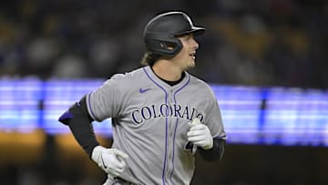 Apr 16, 2025; Los Angeles, California, USA; Colorado Rockies first base Michael Toglia (4) runs after hitting a grand slam home run in the third inning against the Los Angeles Dodgers at Dodger Stadium. Mandatory Credit: Jayne Kamin-Oncea-Imagn Images