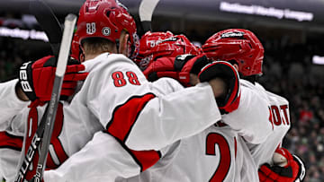 Jan 21, 2025; Dallas, Texas, USA; Carolina Hurricanes center Martin Necas (88) and defenseman Sean Walker (26) and center Jesperi Kotkaniemi (82) and left wing Eric Robinson (50) celebrates a goal scored by Kotkaniemi against the Dallas Stars during the third period at the American Airlines Center. Mandatory Credit: Jerome Miron-Imagn Images