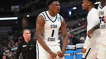 Mar 22, 2024; Indianapolis, IN, USA; Utah State Aggies forward Great Osobor (1) reacts after a play