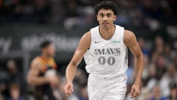 Mar 9, 2025; Dallas, Texas, USA; Dallas Mavericks guard Max Christie (00) runs back up court after he makes a three point basket against the Phoenix Suns during the first quarter at the American Airlines Center. Mandatory Credit: Jerome Miron-Imagn Images