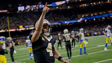 Dec 1, 2024; New Orleans, Louisiana, USA; New Orleans Saints quarterback Derek Carr (4) reacts after rushing for a first down against the Los Angeles Rams during the fourth quarter at Caesars Superdome. Mandatory Credit: Matthew Hinton-Imagn Images