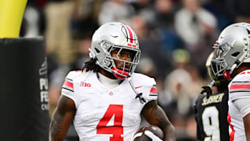 Nov 8, 2025; West Lafayette, Indiana, USA; Ohio State Buckeyes wide receiver Jeremiah Smith (4) celebrates after scoring a touchdown during the second quarter against the Purdue Boilermakers at Ross-Ade Stadium. Mandatory Credit: Marc Lebryk-Imagn Images