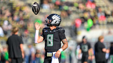 Oct 12, 2024; Eugene, Oregon, USA; Oregon Ducks quarterback Dillon Gabriel (8) warms up before the game against the Ohio State Buckeyes at Autzen Stadium.
