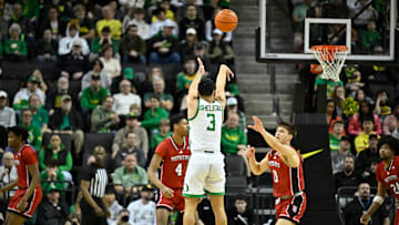 Feb 16, 2025; Eugene, Oregon, USA; Oregon Ducks guard Jackson Shelstad (3) shoots a three-pointer during the second half against the Rutgers Scarlet Knights at Matthew Knight Arena.