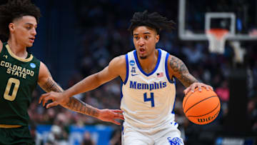 Mar 21, 2025; Seattle, WA, USA; Memphis Tigers guard PJ Haggerty (4) drives the ball during the second half against Colorado State Rams at Climate Pledge Arena. Mandatory Credit: Steven Bisig-Imagn Images