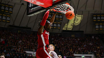 Nov 15, 2024; West Lafayette, Indiana, USA; Alabama Crimson Tide center Clifford Omoruyi (11) dunks over Purdue Boilermakers center Will Berg (44) during the first half at Mackey Arena. Mandatory Credit: Marc Lebryk-Imagn Images