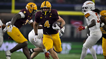 Dec 7, 2024; Arlington, TX, USA; Arizona State Sun Devils running back Cam Skattebo (4) in action during the game between the Iowa State Cyclones and the Arizona State Sun Devils at AT&T Stadium. Mandatory Credit: Jerome Miron-Imagn Images