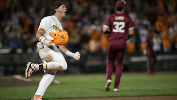 Jun 14, 2024; Omaha, NE, USA;  Tennessee Volunteers left fielder Dylan Dreiling (8) singles in the winning run against the Florida State Seminoles during the ninth inning at Charles Schwab Filed Omaha. Mandatory Credit: Steven Branscombe-USA TODAY Sports