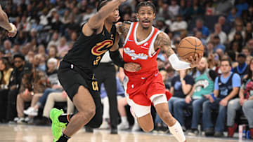 Mar 14, 2025; Memphis, Tennessee, USA; Memphis Grizzlies point guard Ja Morant (12) drives past his defender Cleveland Cavaliers small forward Isaac Okoro (35) in the 2nd quarter of the Cleveland Cavaliers vs. Memphis Grizzlies game at FedExForum. Mandatory Credit: Matthew Smith-Imagn Images
