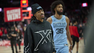 Mar 19, 2025; Portland, Oregon, USA; Memphis Grizzlies guard Ja Morant (12) walks of the court with forward Marvin Bagley III (35) after a game against the Portland Trail Blazers at Moda Center. Mandatory Credit: Troy Wayrynen-Imagn Images