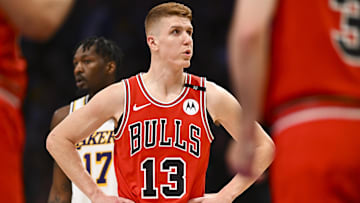 Mar 22, 2025; Los Angeles, California, USA; Chicago Bulls guard Kevin Huerter (13) reacts against Los Angeles Lakers forward Dorian Finney-Smith (17) during the first half at Crypto.com Arena. Mandatory Credit: Jonathan Hui-Imagn Images