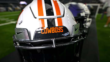 Jul 13, 2023; Arlington, TX, USA; A view of the Oklahoma State Cowboys helmet and logo during the Big 12 football media day at AT&T Stadium. Mandatory Credit: Jerome Miron-Imagn Images