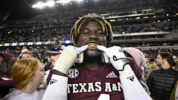 Nov 26, 2022; College Station, Texas, USA; Texas A&M Aggies defensive lineman Shemar Stewart (4) shows off his gold grill smile after the Aggies defeat the LSU Tigers at Kyle Field. Mandatory Credit: Jerome Miron-Imagn Images