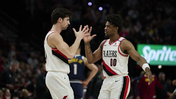 Mar 21, 2025; Portland, Oregon, USA; Portland Trail Blazers forward Deni Avdija (8) and guard Scoot Henderson (00) celebrate during the second half against the Denver Nuggets at Moda Center. Mandatory Credit: Troy Wayrynen-Imagn Images