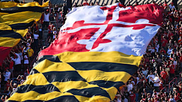 Oct 4, 2025; College Park, Maryland, USA;  Fans wave a large Maryland state flag during a NCAA football game between the Maryland Terrapins and the Washington Huskies at SECU Stadium. Mandatory Credit: Jamie Sabau-Imagn Images
