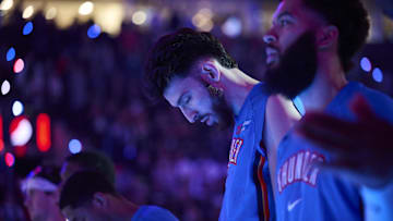 Nov 30, 2025; Portland, Oregon, USA; Oklahoma City Thunder center Chet Holmgren (7) stands with teammates during the singing of the national anthem before a game against the Portland Trail Blazers at Moda Center. Mandatory Credit: Troy Wayrynen-Imagn Images