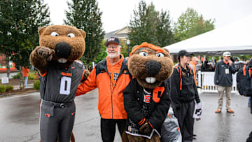 Oct 11, 2025; Corvallis, Oregon, USA; Oregon State Beavers fan poses with the mascots Benny and Bernice outside Reser Stadium before the game against the Wake Forest Demon Deacons. Mandatory Credit: Craig Strobeck-Imagn Images