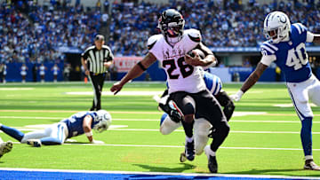 Sep 8, 2024; Indianapolis, Indiana, USA; Houston Texans running back Joe Mixon (28) runs the ball in for a touchdown in front of Indianapolis Colts cornerback Jaylon Jones (40) during the second half at Lucas Oil Stadium. Mandatory Credit: Marc Lebryk-Imagn Images