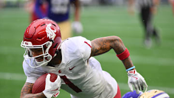 Sep 14, 2024; Seattle, Washington, USA; Washington State Cougars wide receiver Kris Hutson (1) carries the ball.
