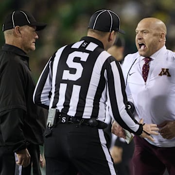 Nov 14, 2025; Eugene, Oregon, USA; Minnesota Golden Gophers head coach P.J. Fleck reacts to an officials call during the first half in a game against the Oregon Ducks at Autzen Stadium. Mandatory Credit: Troy Wayrynen-Imagn Images