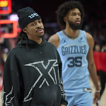 Mar 19, 2025; Portland, Oregon, USA; Memphis Grizzlies guard Ja Morant (12) walks of the court with forward Marvin Bagley III (35) after a game against the Portland Trail Blazers at Moda Center. Mandatory Credit: Troy Wayrynen-Imagn Images