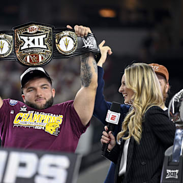Dec 7, 2024; Arlington, TX, USA; Arizona State Sun Devils running back Cam Skattebo (4) holds up the WWE Big 12 championship belt after the Sun Devils defeat the Iowa State Cyclones and win the 2024 Big 12 Championship at AT&T Stadium. Mandatory Credit: Jerome Miron-Imagn Images
