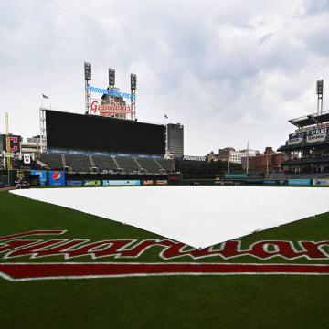 Aug 17, 2023; Cleveland, Ohio, USA; The tarp covers the field as the game between the Cleveland Guardians and the Detroit Tigers is postponed at Progressive Field.