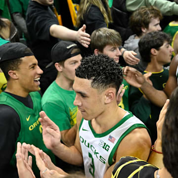 Mar 4, 2025; Eugene, Oregon, USA; Oregon Ducks guard Jackson Shelstad (3) is congratulated by fans after a 73-64 win against the Indiana Hoosiers at Matthew Knight Arena. Mandatory Credit: Craig Strobeck-Imagn Images